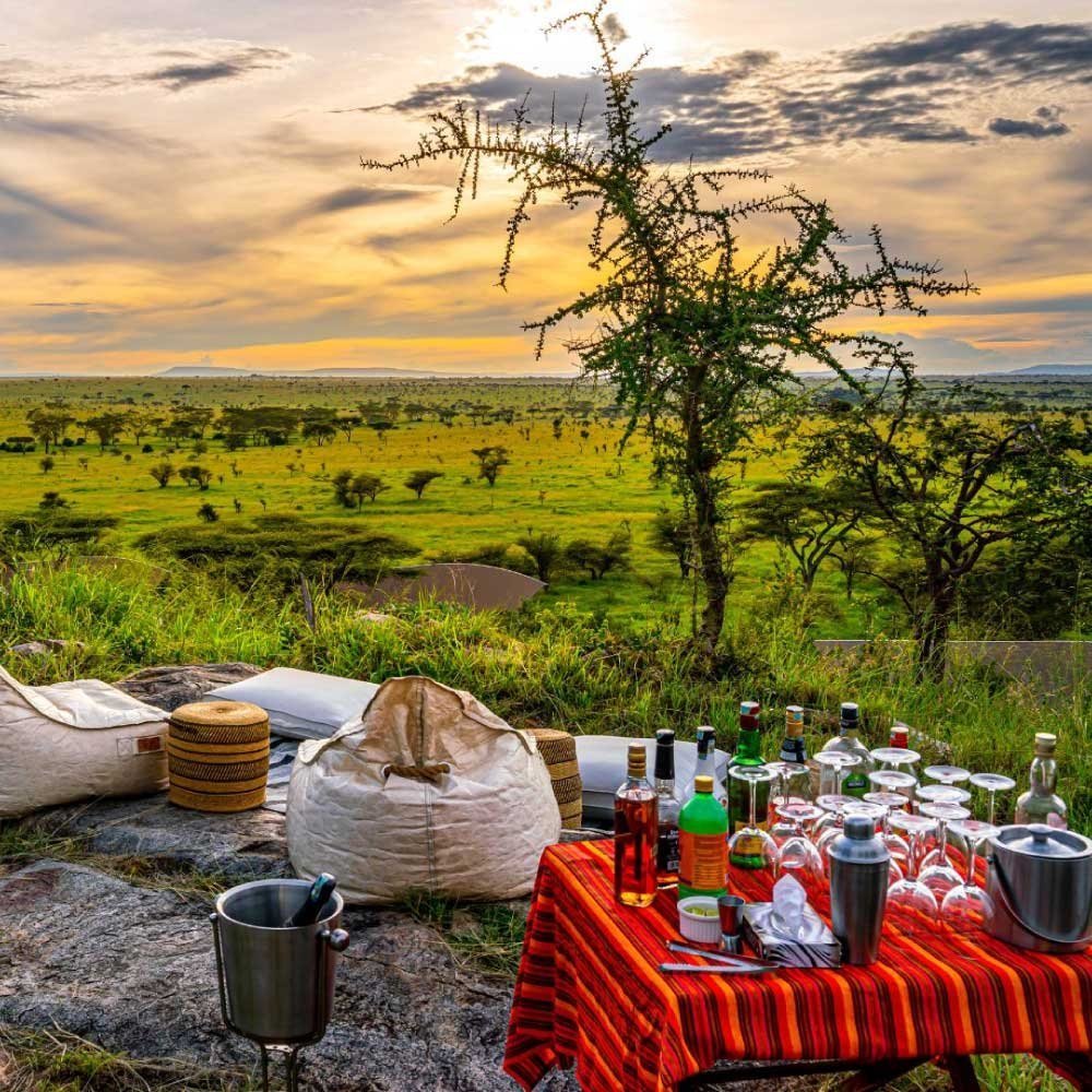 A safari sundowner setting in the Serengeti